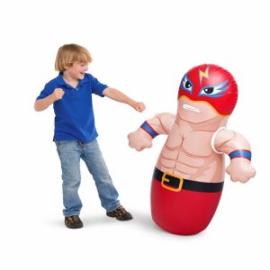 Boy punching inflatable superhero toy
